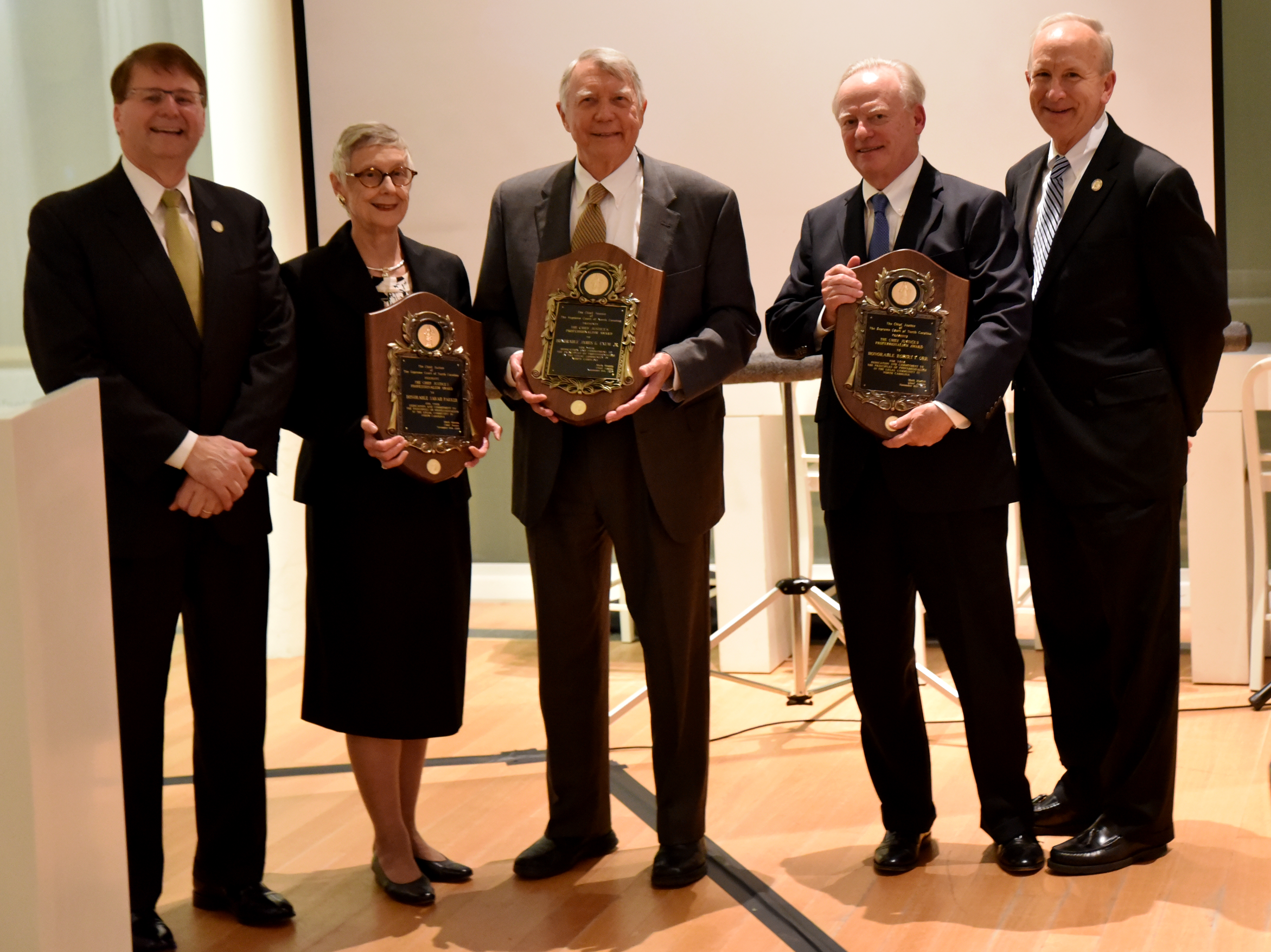 From left to right, Chief Justice Mark Martin, former Chief Justice Sarah Paraker, former Chief Justice James G. Exum, Jr.,  fromer Associate Justice Robert F. Orr, and Senior Associate Justice Paul Newby