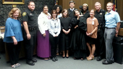 Chief District Court Judge Lisa V. Menefee poses with BB, staff, and judges