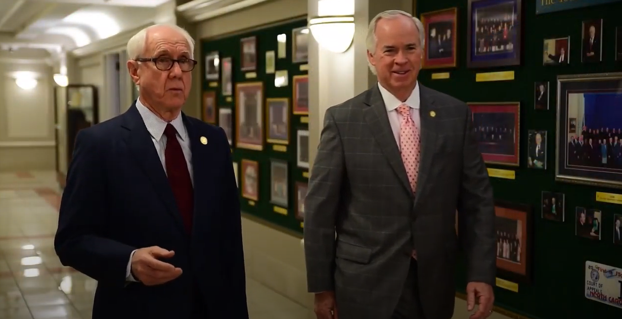Former Chief Judge Gerald Arnold (left) and Mel Wright walk the halls of the North Carolina Court of Appeals.
