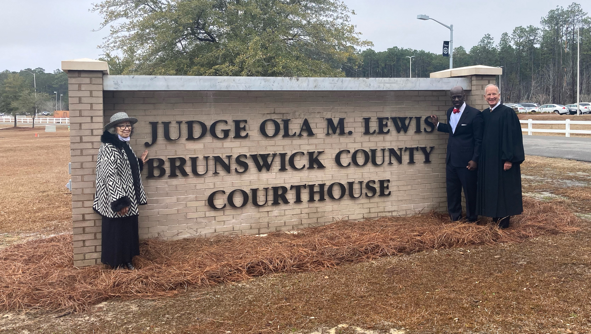 (Left to right) Doris Lewis (mother of Judge Lewis), Reggie Holley (husband of Judge Lewis), and Chief Justice Paul Newby.