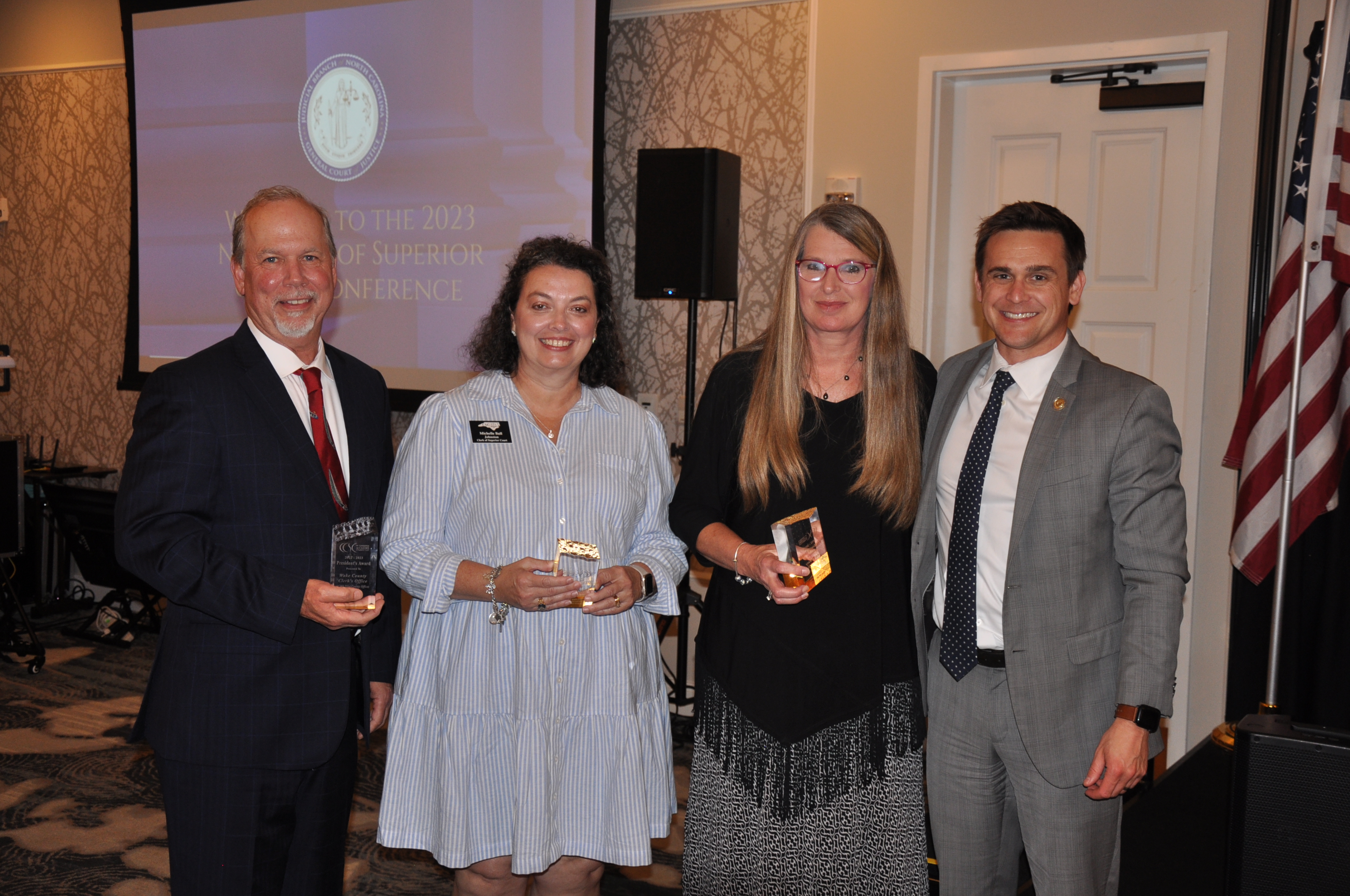 From left to right, Wake County Clerk Blair Williams, Johnston County Clerk Michelle Ball, Lee County Clerk Susie Thomas, and NCAOC Director Ryan Boyce. 