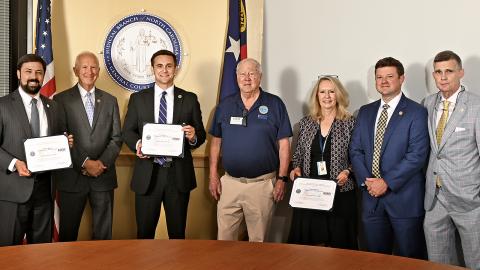 Andrew Brown, Chief Justice Paul Newby, Director Ryan Boyce, Ken Oppenheim (area chair of Employer Support of the Guard and Reserve), Nicole Brinkley, Lieutenant Colonel William Hart, and North Carolina National Guard Staff Judge Advocate Colonel Robert Kemp.