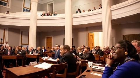 Chief Justice Mark Martin (far left), Associate Justice Mike Morgan (left), Associate Justice Robin Hudson (center), and former Associate Justice Patricia Timmons-Goodson (right) look on as the 1868 North Carolina Constitutional Convention is reenacted.