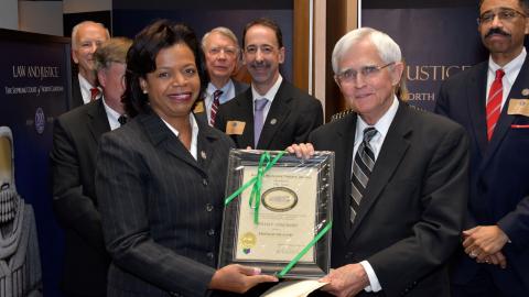 Chief Justice Cheri Beasley presents Friend of the Court award to Justice Willis Whichard