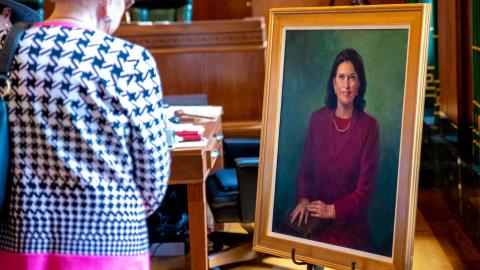 Special guests viewing Clerk Roeder's portrait during the presentation ceremony in March.