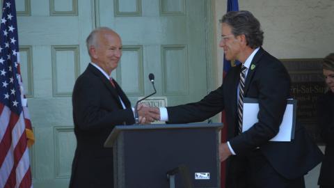 Supreme Court of North Carolina Chief Justice Paul Newby shakes hands with Rowan County Chief District Court Judge and Chair of the North Carolina Sentencing Policy and Advisory Commission Charlie Brown