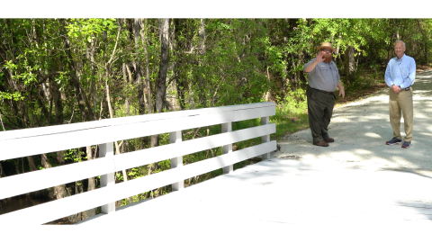 Chief Justice Newby (right) and Jason Howell looking across Moores Creek Bridge