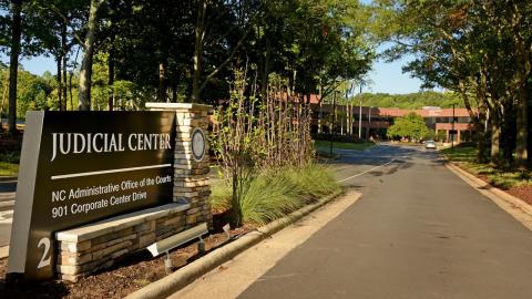 NCAOC entrance sign and building in background